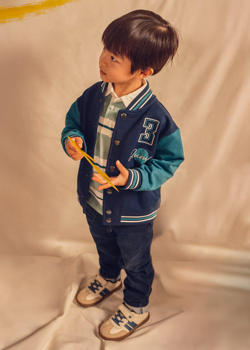 Mayoral Boys Slim Fit Drawstring Jeans - model front view with varsity jacket