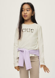 Girl wearing Mayoral CHIC sequin long sleeve top – on model front view