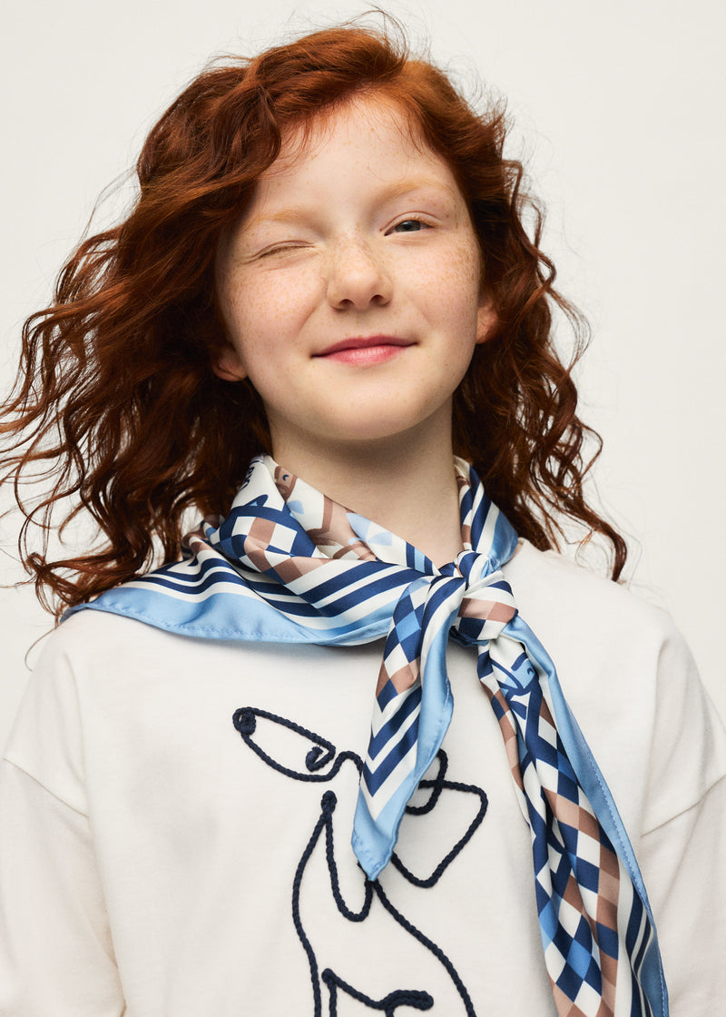 Girl wearing Mayoral Mon Chien long sleeve top with dachshund print scarf tied at neck