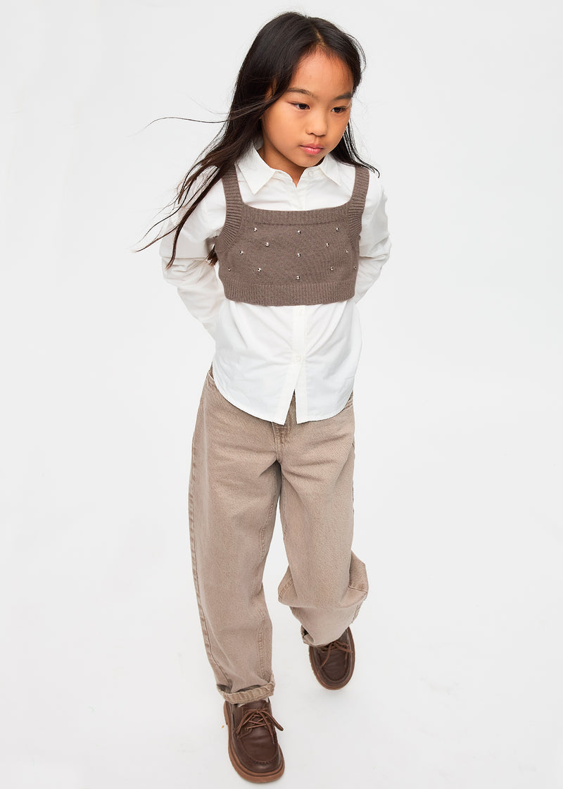 Girl wearing Mayoral rhinestone knit vest over cream shirt – close-up portrait showing vest detail
