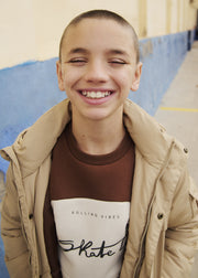 Boy wearing Mayoral Nukutavake Skate Lab colour-block sweatshirt styled with khaki cargo trousers – on model full body view