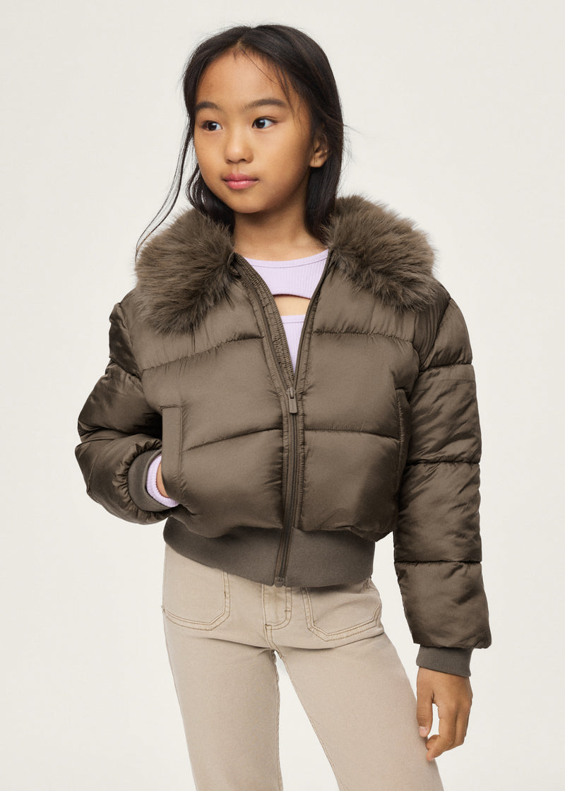 Girl wearing Mayoral khaki cropped puffer jacket with faux fur collar – on model front view styled with cream jeans