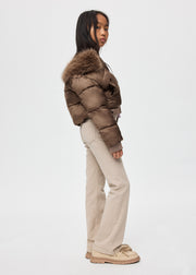 Girl wearing Mayoral khaki puffer jacket – side profile view showing cropped bomber silhouette and faux fur collar