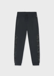 Mayoral Nukutavake black jogger trousers – elasticated drawstring waistband and Altitud Cero zip pocket badge detail close-up