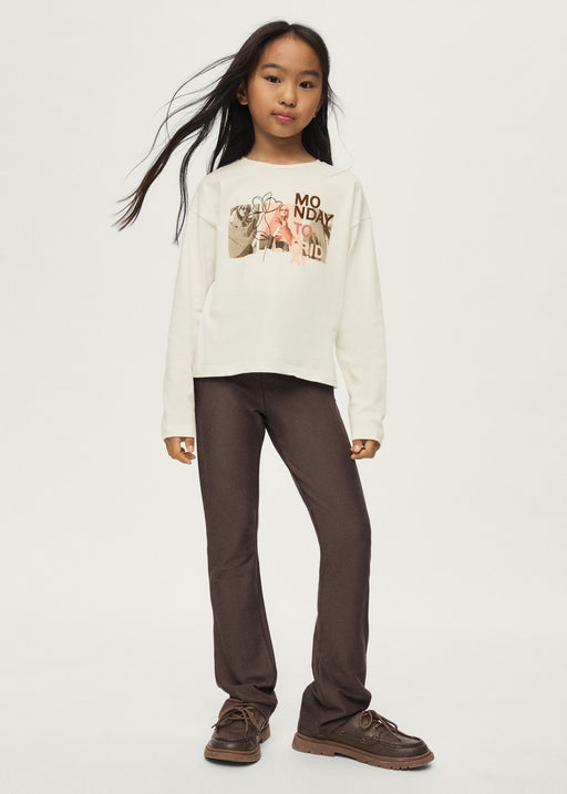 Girl wearing Mayoral Monday to Friday graphic top with chocolate brown flare trousers and brown boat shoes – on model full body front view