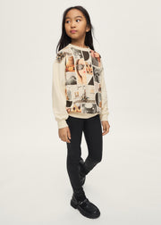 Girl wearing Mayoral photo collage sweatshirt with black coated leggings and chunky loafers – on model full body side view