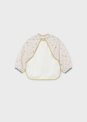 Mayoral baby circus star long-sleeve smock bib – back view showing button neck fastening and star print sleeves