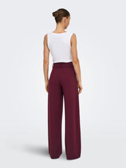 JDY wide leg jersey trousers in burgundy - front on model full length