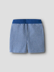 Blue and white striped shorts on a light gray background