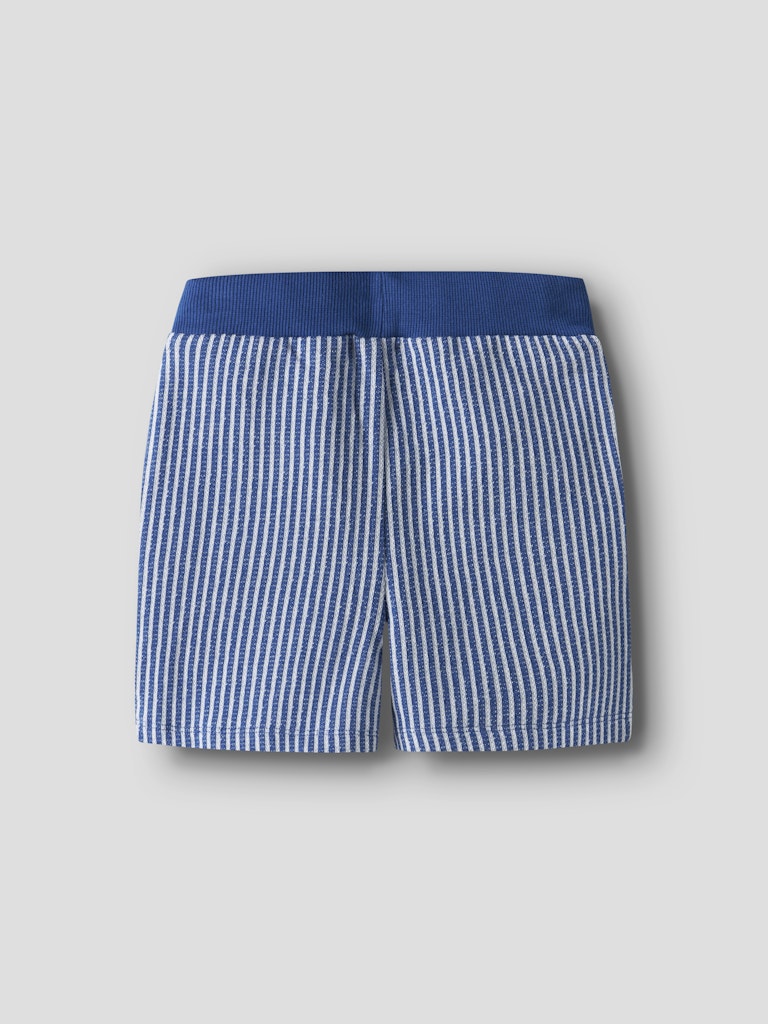 Blue and white striped shorts on a light gray background